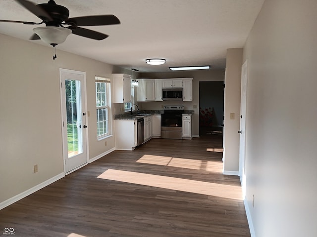 18851 Wimbley Way, Noblesville, IN 46060 - kitchen featuring stainless steel appliances, white cabinets, dark wood-style floors, and ceiling fan