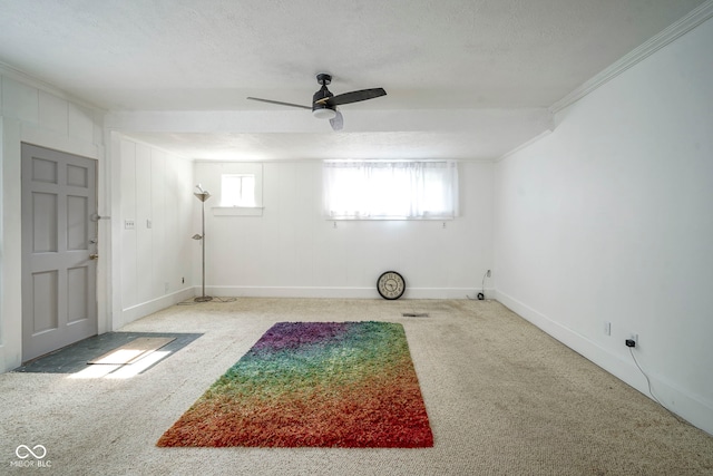 307 E 5th St, Sheridan, IN 46069 - empty room with carpet floors, crown molding, a ceiling fan, baseboards, and a textured ceiling