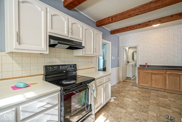 307 E 5th St, Sheridan, IN 46069 - kitchen with black electric range, under cabinet range hood, beam ceiling, decorative backsplash, and white cabinets