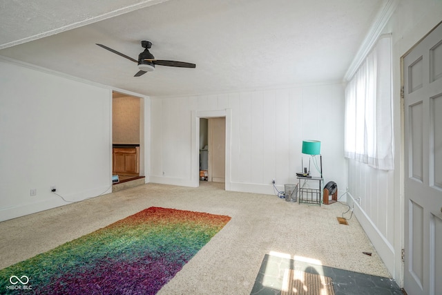 307 E 5th St, Sheridan, IN 46069 - unfurnished living room with ceiling fan, carpet floors, and crown molding