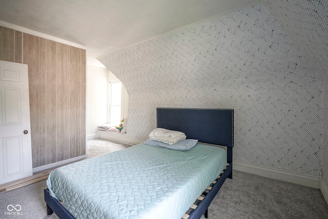 307 E 5th St, Sheridan, IN 46069 - bedroom featuring carpet, lofted ceiling, baseboards, and wood walls