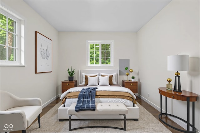 1948 Bloyd Ave, Indianapolis, IN 46218 - bedroom featuring multiple windows and wood finished floors