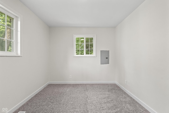 1948 Bloyd Ave, Indianapolis, IN 46218 - carpeted empty room with electric panel and baseboards