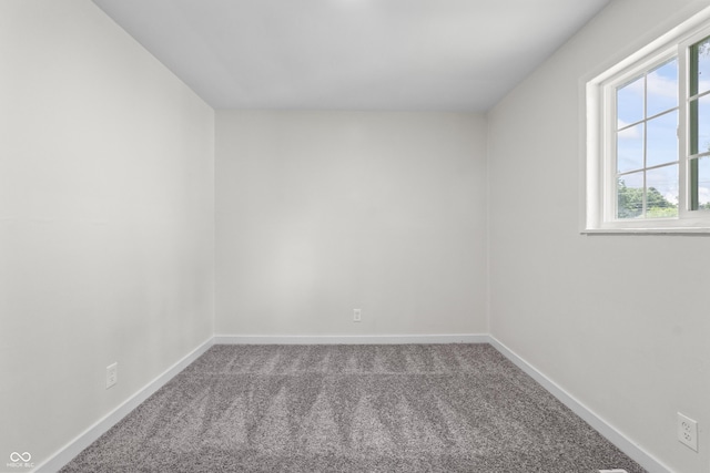 1948 Bloyd Ave, Indianapolis, IN 46218 - spare room featuring carpet floors and baseboards