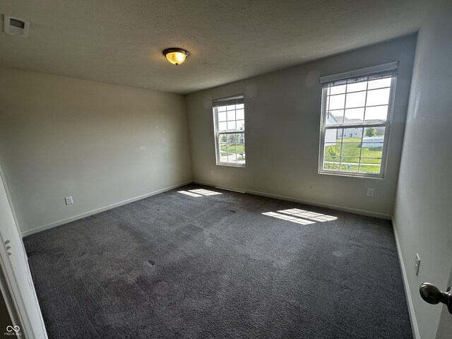1218 Bedford Dr, Avon, IN 46123 - unfurnished room featuring carpet floors, baseboards, and a textured ceiling