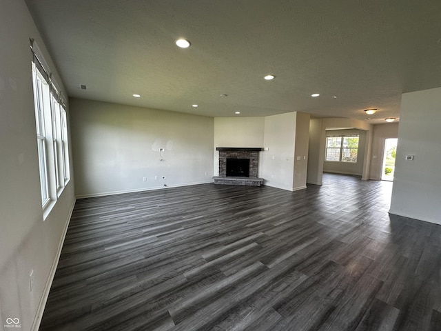1218 Bedford Dr, Avon, IN 46123 - unfurnished living room with recessed lighting, dark wood finished floors, baseboards, and a fireplace
