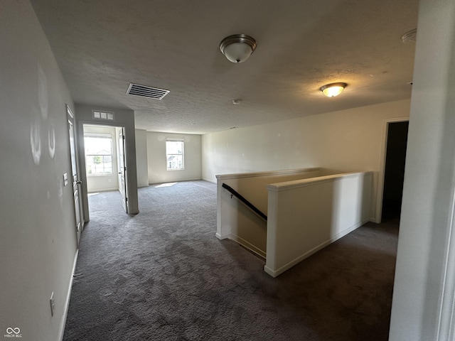 1218 Bedford Dr, Avon, IN 46123 - hall with an upstairs landing, carpet flooring, a textured ceiling, and baseboards