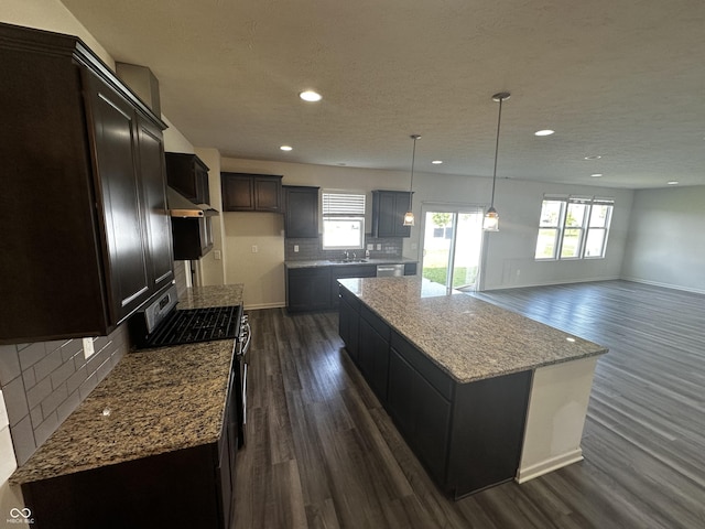 1218 Bedford Dr, Avon, IN 46123 - kitchen with dark wood finished floors, a center island, stainless steel appliances, recessed lighting, and backsplash