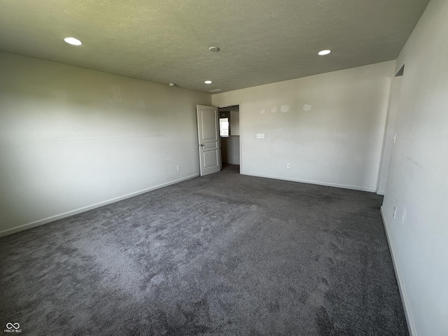 1218 Bedford Dr, Avon, IN 46123 - unfurnished room featuring recessed lighting, dark colored carpet, baseboards, and a textured ceiling