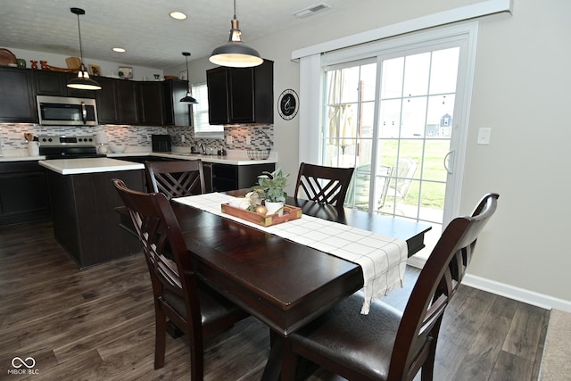 680 Albermarle Dr, Pittsboro, IN 46167 - dining room featuring dark wood-style floors, plenty of natural light, recessed lighting, and baseboards