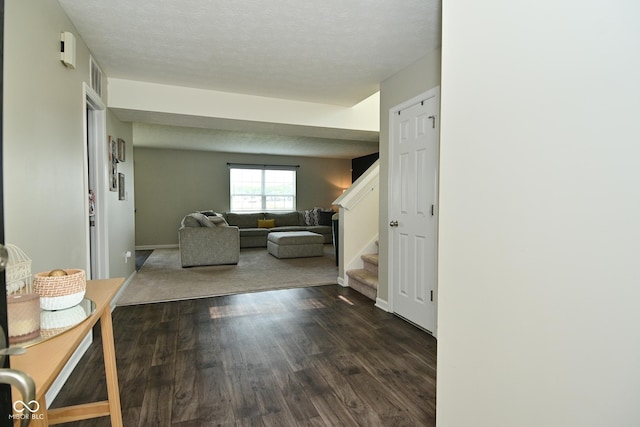680 Albermarle Dr, Pittsboro, IN 46167 - corridor with stairs, dark wood-style floors, a textured ceiling, and baseboards