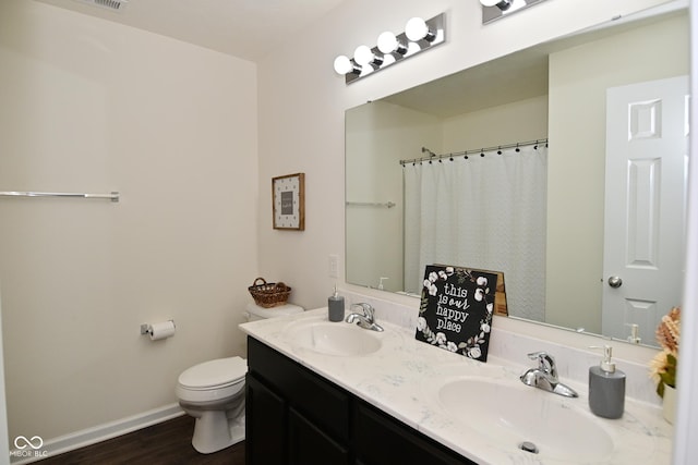 680 Albermarle Dr, Pittsboro, IN 46167 - bathroom with double vanity, baseboards, toilet, wood finished floors, and a shower with shower curtain