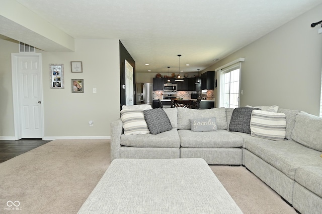 680 Albermarle Dr, Pittsboro, IN 46167 - living room with dark colored carpet, baseboards, and recessed lighting