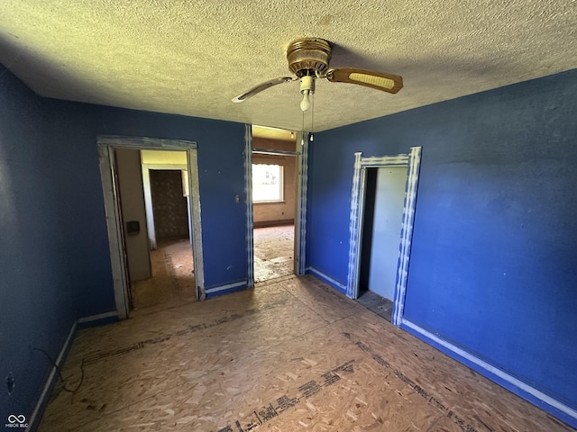1739 E 18th St, Anderson, IN 46016 - unfurnished bedroom with a textured ceiling and a ceiling fan