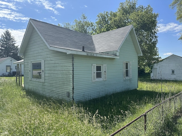 1739 E 18th St, Anderson, IN 46016 - view of property exterior featuring roof with shingles