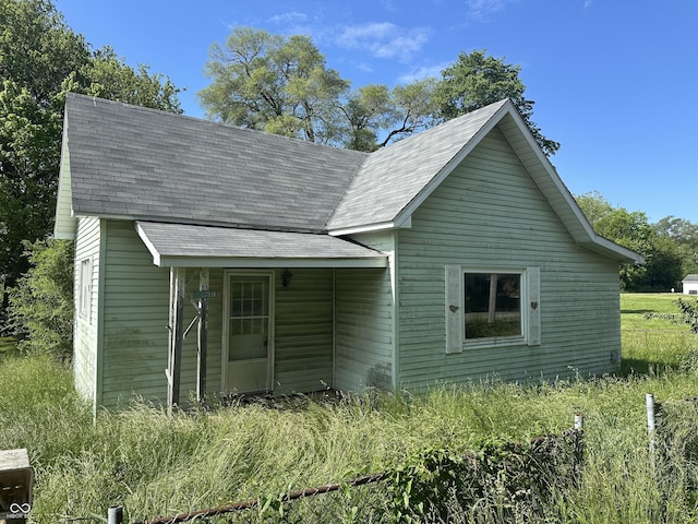 1739 E 18th St, Anderson, IN 46016 - view of front of house featuring roof with shingles
