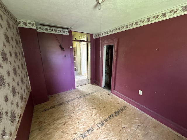 1739 E 18th St, Anderson, IN 46016 - spare room with a textured ceiling