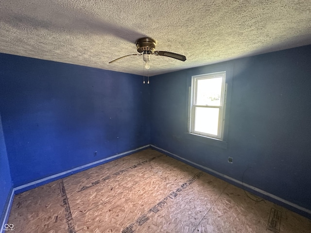1739 E 18th St, Anderson, IN 46016 - unfurnished room featuring baseboards, a textured ceiling, and a ceiling fan