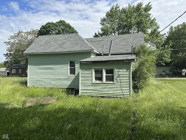 1739 E 18th St, Anderson, IN 46016 - view of side of property featuring roof with shingles