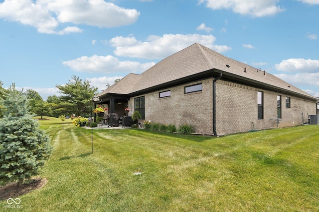 1295 Maclaren Ct, Franklin, IN 46131 - view of property exterior featuring a lawn, cooling unit, brick siding, and a patio