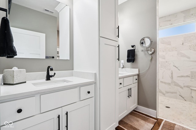 1295 Maclaren Ct, Franklin, IN 46131 - full bath featuring vanity, tiled shower, and baseboards