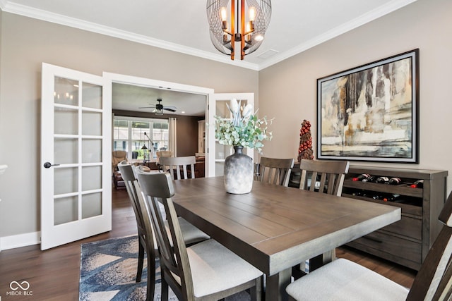 1295 Maclaren Ct, Franklin, IN 46131 - dining room with crown molding, wood finished floors, a chandelier, and baseboards