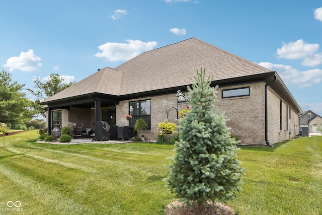 1295 Maclaren Ct, Franklin, IN 46131 - back of house with a patio, brick siding, and a yard