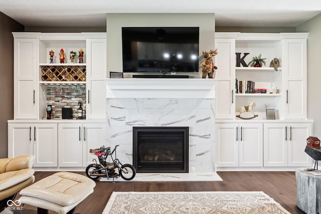 1295 Maclaren Ct, Franklin, IN 46131 - living area featuring dark wood-type flooring, a high end fireplace, and a bar