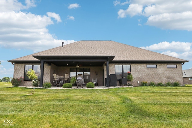 1295 Maclaren Ct, Franklin, IN 46131 - rear view of property with brick siding, ceiling fan, a lawn, roof with shingles, and a patio area
