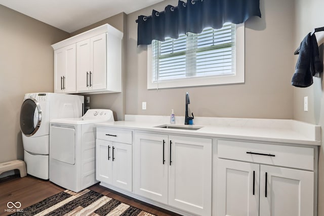 1295 Maclaren Ct, Franklin, IN 46131 - laundry room with washer and dryer, cabinet space, and dark wood-style flooring