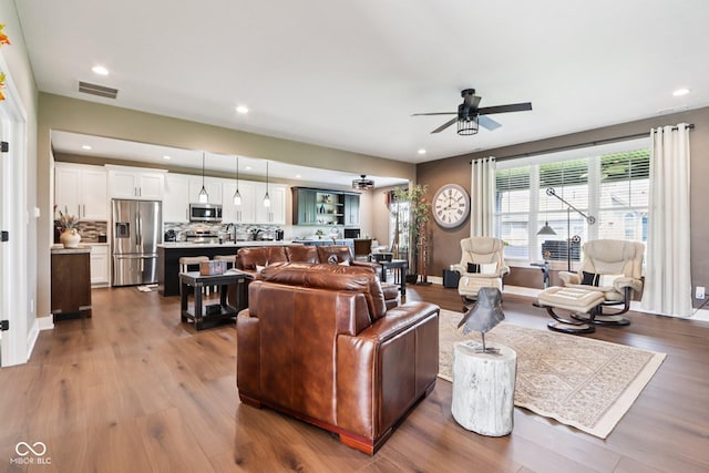 1295 Maclaren Ct, Franklin, IN 46131 - living area featuring ceiling fan, recessed lighting, dark wood-style floors, and baseboards