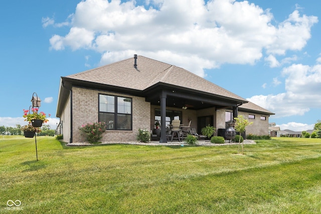 1295 Maclaren Ct, Franklin, IN 46131 - back of property featuring a patio, a shingled roof, brick siding, and a yard
