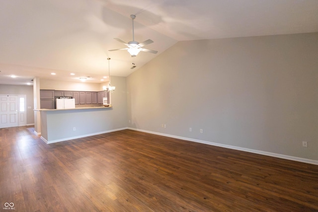 4291 Washington Blvd, Plainfield, IN 46168 - unfurnished living room with a ceiling fan, a chandelier, lofted ceiling, baseboards, and dark wood-type flooring