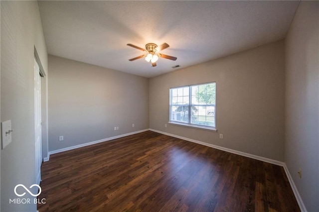 4291 Washington Blvd, Plainfield, IN 46168 - empty room featuring ceiling fan, dark wood-style flooring, and baseboards