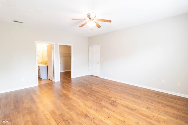 4291 Washington Blvd, Plainfield, IN 46168 - empty room featuring a ceiling fan, light wood-type flooring, and baseboards