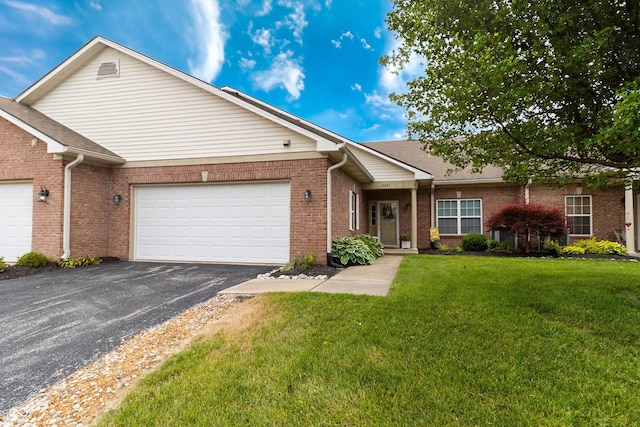 4291 Washington Blvd, Plainfield, IN 46168 - ranch-style house featuring driveway, a front lawn, brick siding, and an attached garage