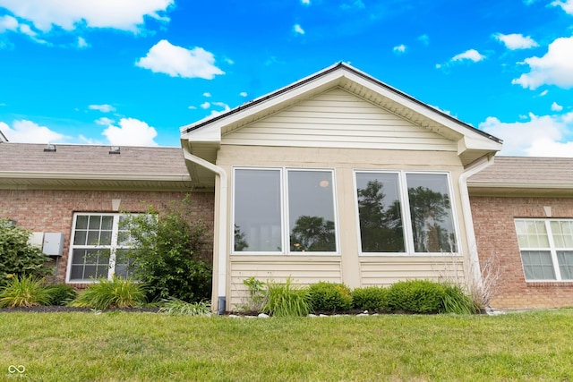 4291 Washington Blvd, Plainfield, IN 46168 - view of home's exterior with brick siding and a lawn