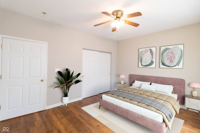 4291 Washington Blvd, Plainfield, IN 46168 - bedroom with wood finished floors, a closet, baseboards, and ceiling fan