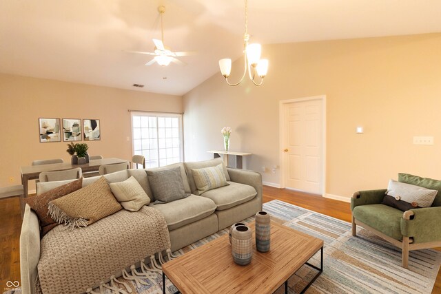 4291 Washington Blvd, Plainfield, IN 46168 - living area featuring vaulted ceiling, wood finished floors, a ceiling fan, baseboards, and a chandelier