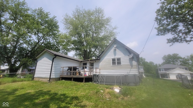 7879 Main St, Coatesville, IN 46121 - back of house with a wooden deck and an outdoor pool
