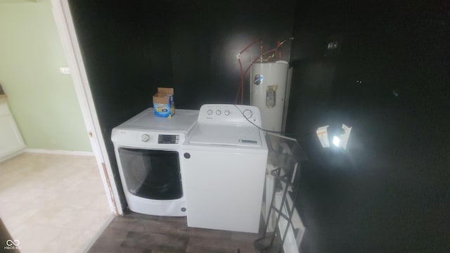 7879 Main St, Coatesville, IN 46121 - laundry room with washing machine and clothes dryer, electric water heater, and baseboards
