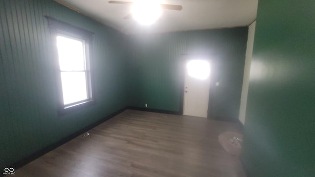 7879 Main St, Coatesville, IN 46121 - unfurnished room with wood finished floors, a ceiling fan, and baseboards