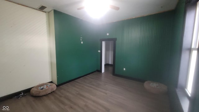 7879 Main St, Coatesville, IN 46121 - empty room featuring wood finished floors, a ceiling fan, and baseboards