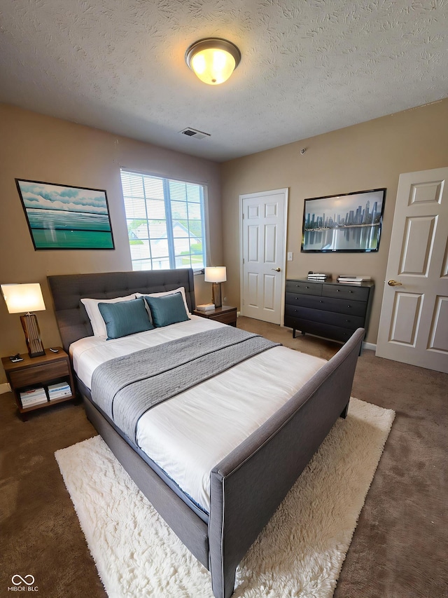 5011 Amber Creek Pl Unit 205, Indianapolis, IN 46237 - bedroom featuring carpet, a textured ceiling, and baseboards