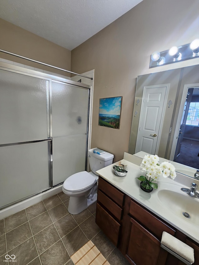 5011 Amber Creek Pl Unit 205, Indianapolis, IN 46237 - bathroom featuring a stall shower, vanity, toilet, and tile patterned floors