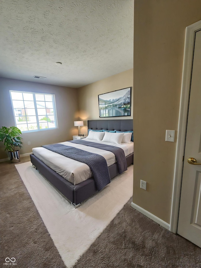 5011 Amber Creek Pl Unit 205, Indianapolis, IN 46237 - bedroom with carpet flooring, a textured ceiling, and baseboards