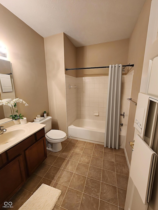 5011 Amber Creek Pl Unit 205, Indianapolis, IN 46237 - bathroom with shower / tub combo, vanity, toilet, tile patterned flooring, and a textured ceiling