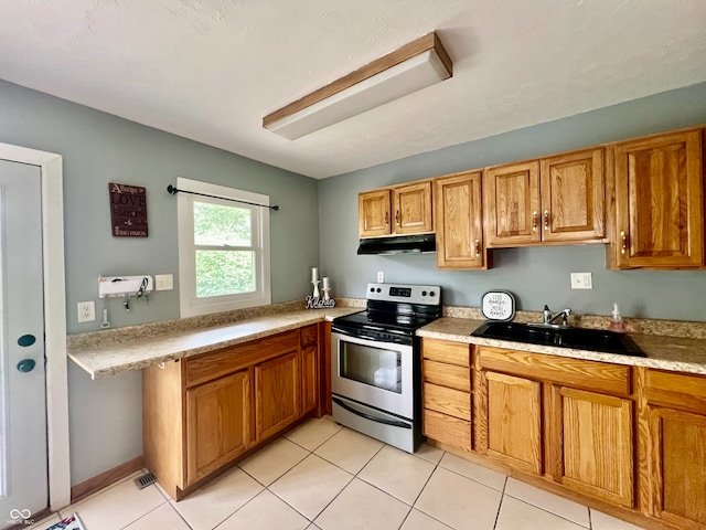 2833 Desoto Way, Columbus, IN 47203 - kitchen featuring stainless steel electric range oven, under cabinet range hood, a sink, brown cabinetry, and light tile patterned floors