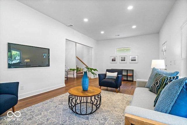 1709 Fletcher Ave, Indianapolis, IN 46203 - living room featuring wood finished floors, recessed lighting, baseboards, and stairs
