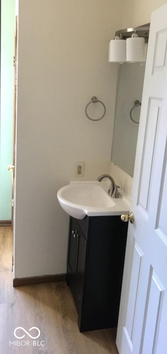 55 W Fall Creek Parkway S Drive, Indianapolis, IN 46208 - bathroom with vanity and wood finished floors